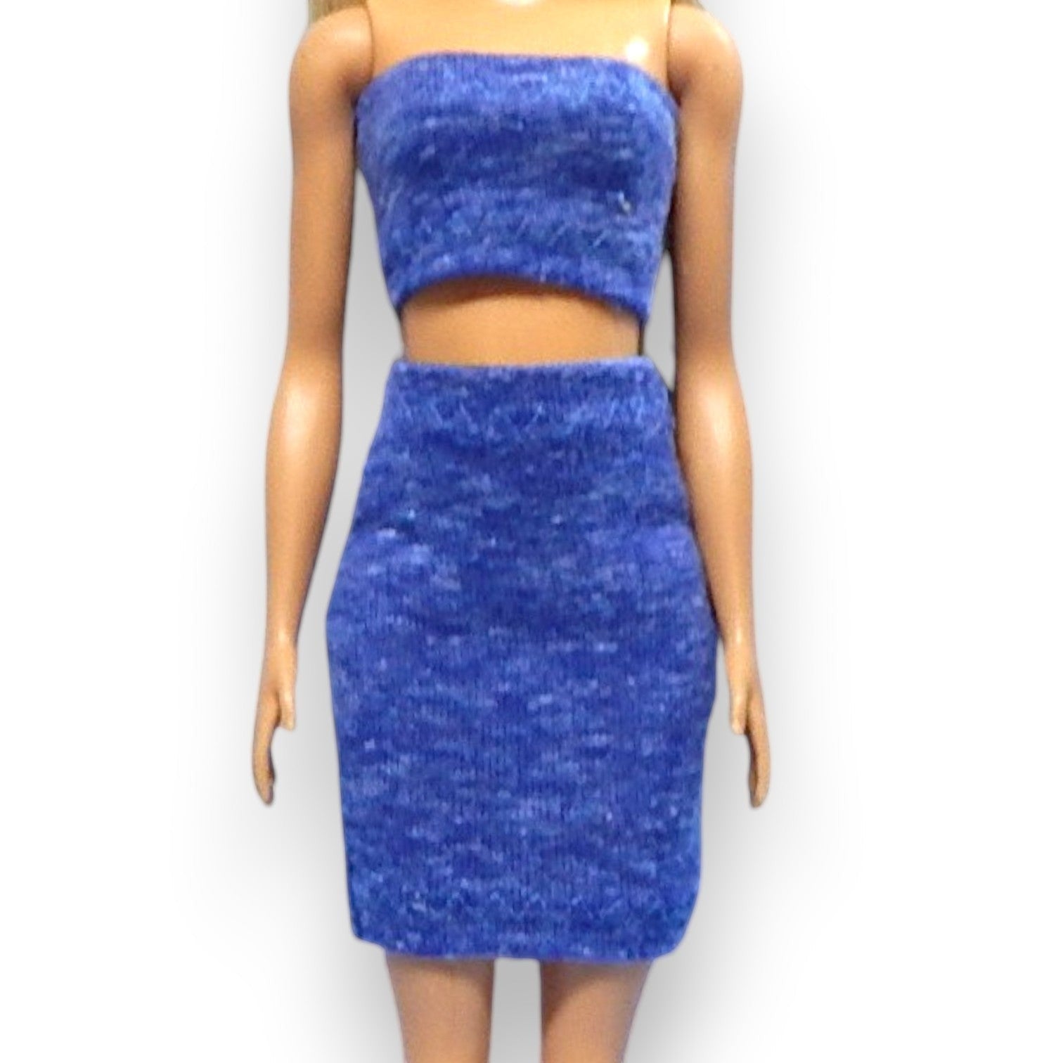 Nikols Design doll wearing a blue textured strapless crop top and matching high-waisted mini skirt
