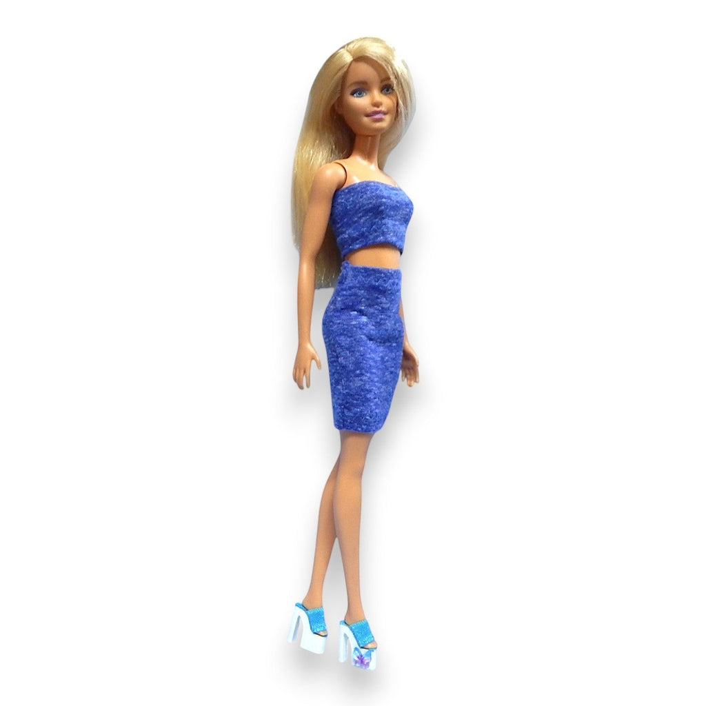 Nikols Design doll wearing a vibrant blue textured two-piece strapless crop top and high-waisted mini skirt set